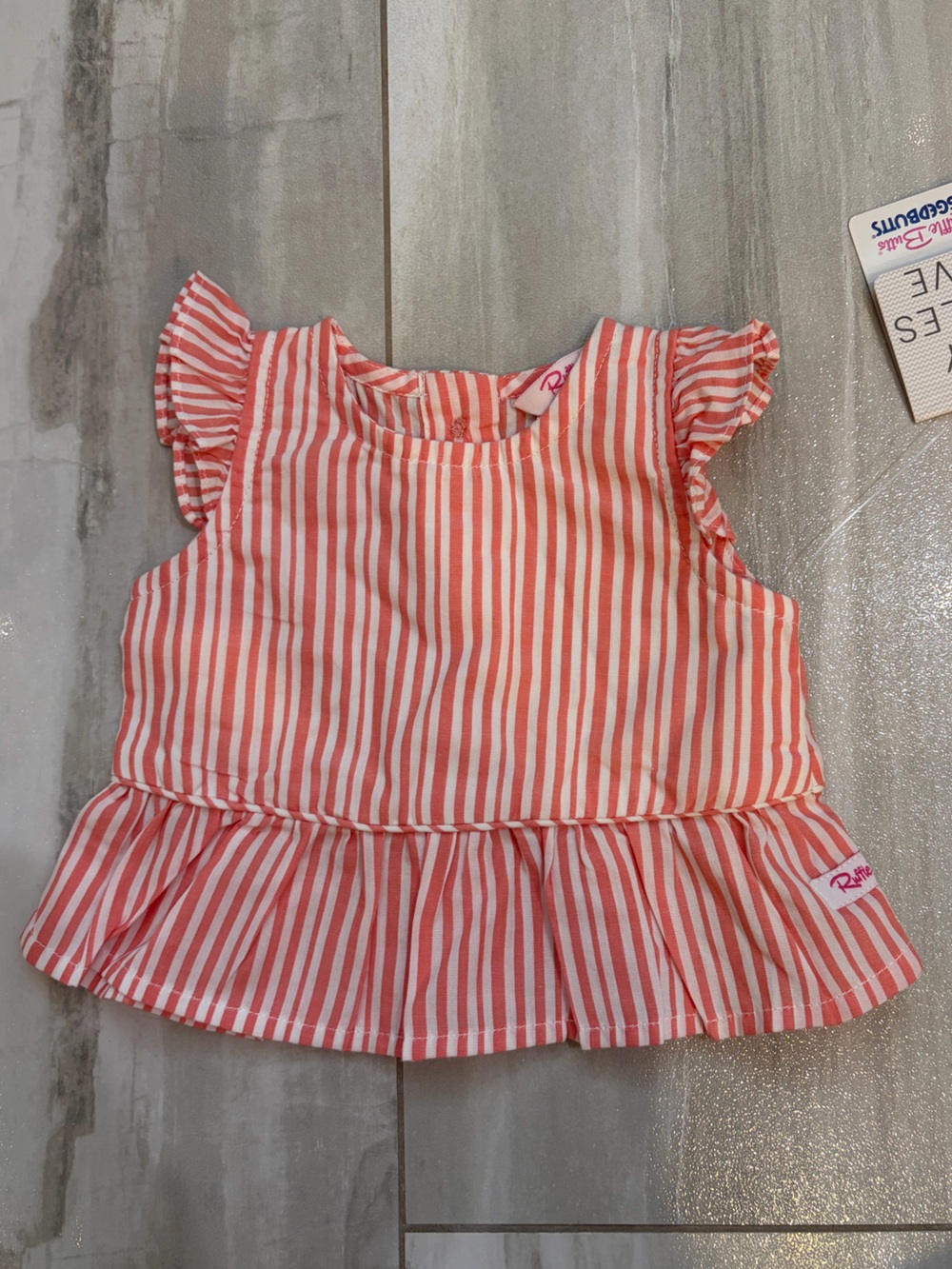 NWT RuffleButts Vibrant Coral Stripe Sleeveless Cotton Peplum Shirt Girls 0-3M